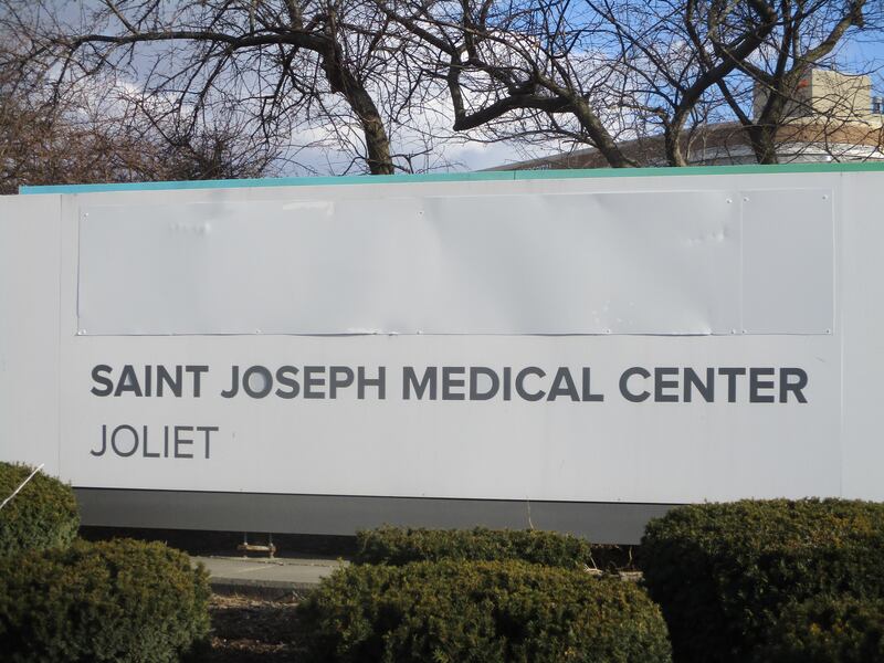 Reference to previous ownership is covered up on Saint Joseph Medical Center sign facing Glenwood Avenue on Thursday. California-based Prime Healthcare takes ownership of the Joliet hospital on Saturday. Feb. 27, 2025