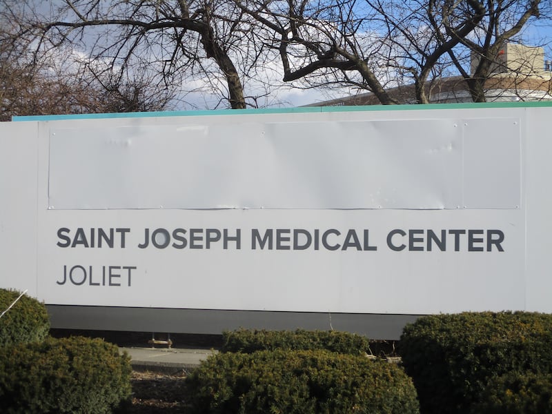 Reference to previous ownership is covered up on Saint Joseph Medical Center sign facing Glenwood Avenue on Thursday. California-based Prime Healthcare takes ownership of the Joliet hospital on Saturday. Feb. 27, 2025