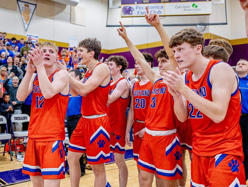 Eastland waits to accept the sectional plaque after taking down Pecatonica in the sectional final on Friday, March 7, 2025 at Pecatonica High School.