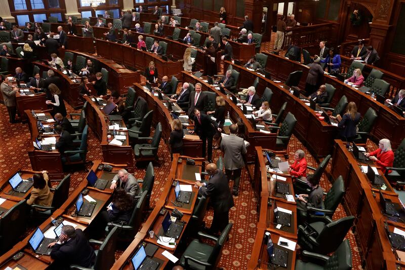 FILE -State representatives debate end of the year legislation on the House floor during veto session Tuesday, Dec. 2, 2014 at the Illinois State Capitol in Springfield Ill. (AP Photo/Seth Perlman, File)