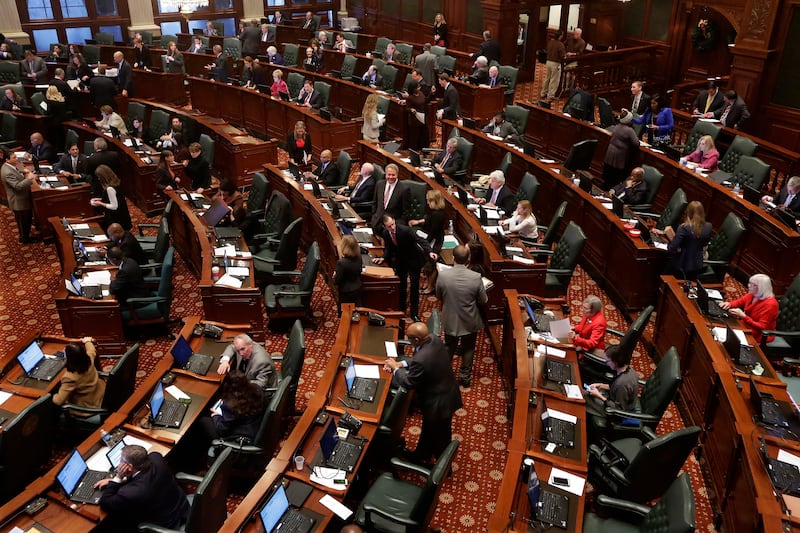 FILE -State representatives debate end of the year legislation on the House floor during veto session Tuesday, Dec. 2, 2014 at the Illinois State Capitol in Springfield Ill. (AP Photo/Seth Perlman, File)