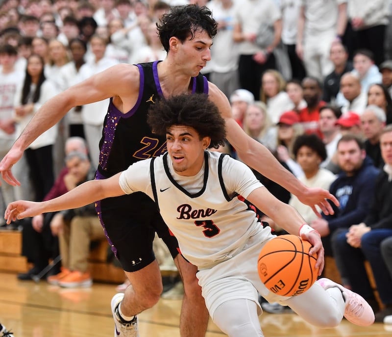 Benet’s Jayden Wright (3) drives past Downers Grove North’s Aidan Akkawi during the Class 4A Benet Sectional championship game on March 7, 2025 at Benet Academy in Lisle.