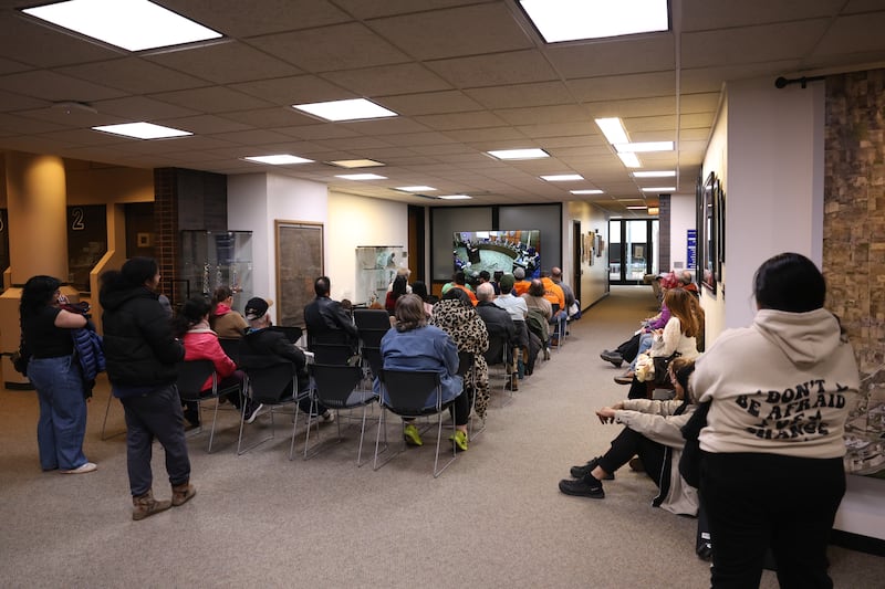 Residents watch from an overflow area at the proposed data center at the City of Joliet City Council meeting on Monday, March 16, 2026 in Joliet.