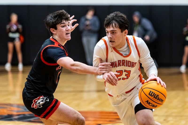 Lincoln-Way West's Eiden Kubilius drives to the basket as Lincoln-Way Central's Nolan Morrill defends during a varsity basketball game at Lincoln-Way West on Jan. 27, 2026.