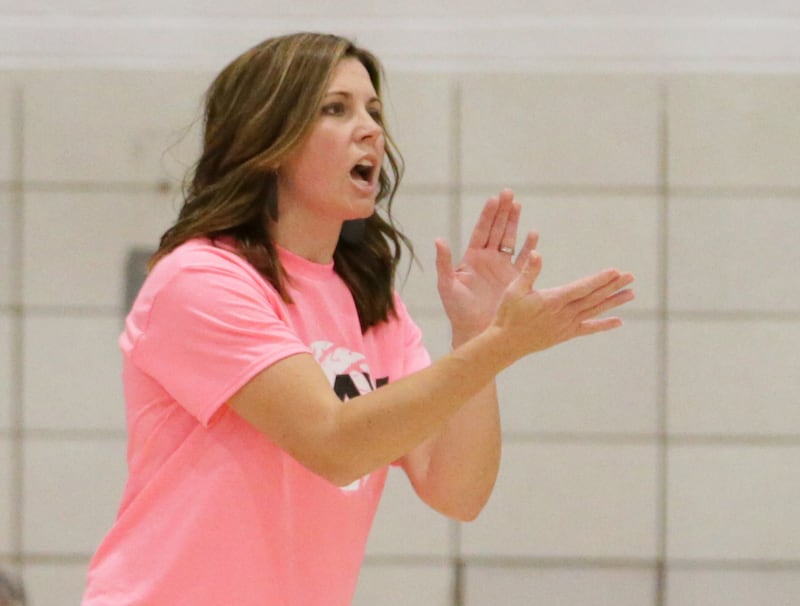 Woodland head volleyball coach Michelle Pitte applauds as her team closes out with a win over Dwight in two sets on Thursday, Oct. 6, 2022 at Woodland.