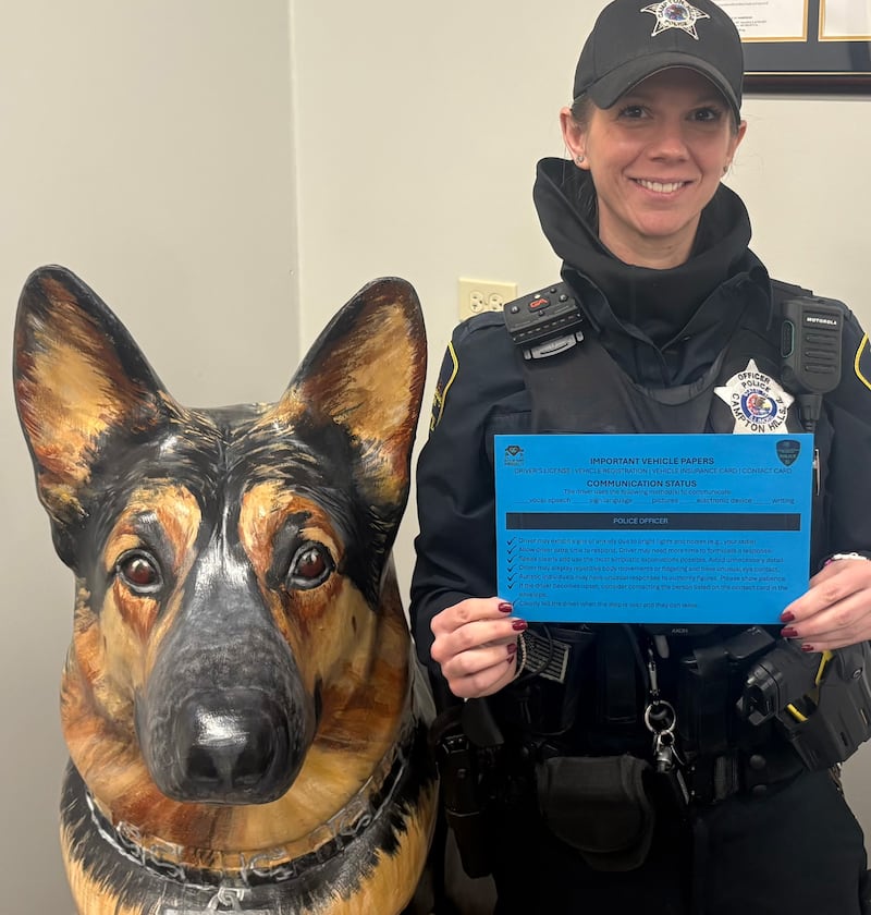 Campton Hills police K9 Koda – a statue of him anyway, since he's semi-retired – and Officer Stavroula Tsina – promote the Blue Envelope Program. The Blue Envelope is an initiative to foster safer, more positive interactions between law enforcement and individuals on the autism spectrum.