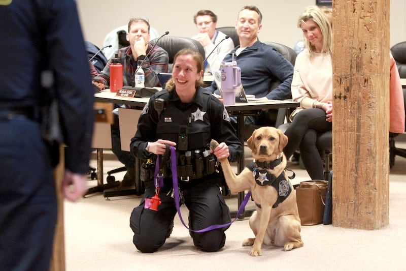 River, the Batavia Police Department’s new 11-month-old comfort dog, is sworn in with her handler, Officer Liz Webb, on Monday, April 21, 2025 during a Batavia City Council meeting.
