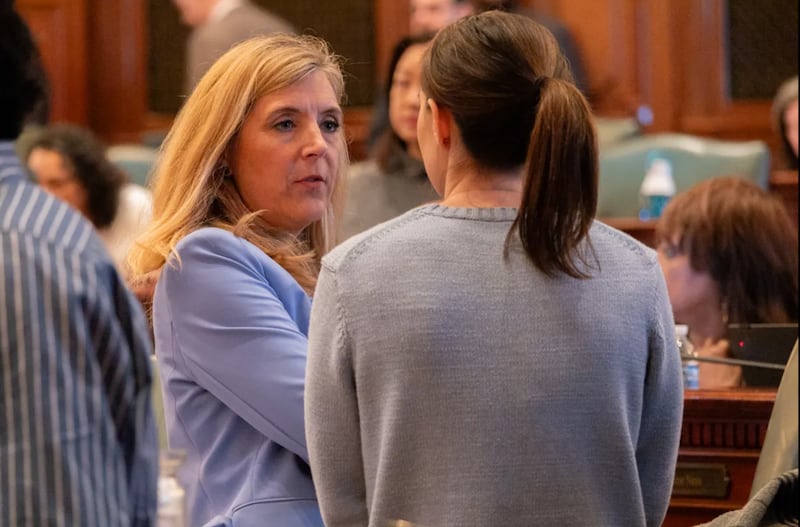 Rep. Terra Costa Howard, D-Glen Ellyn, speaks to a House colleague shortly after making a speech on April 14, 2025, in favor of her bill creating new homeschool oversight in Illinois.