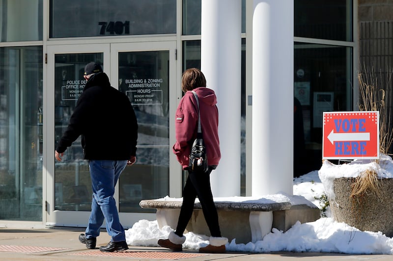 Voters walk into a Spring Grove polling location on Tuesday, March, 17, 2026, to cast their ballots in the Illinois primary election.