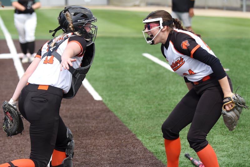 Gardner-South Wilmington's Kayla Scheuber, left, and Maddie Simms celebrate after the Panthers recorded an out at home plate to end the first inning of the Class 1A Illinois Wesleyan Supersectional against Meridian at Inspiration Field at Carol Willis Park in Bloomington Monday, June 1, 2026.