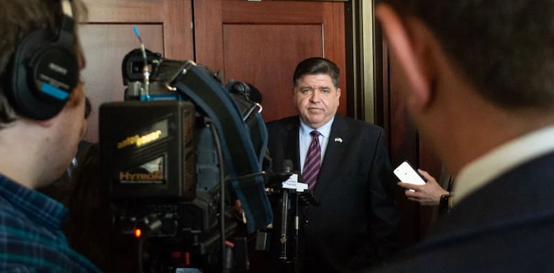 Gov. JB Pritzker speaks to reporters following an event at the Illinois State Library in Springfield on Wednesday, May 28, 2025. Pritzker pledged to veto any budget with “broad-based” tax increases.