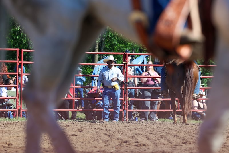 Mike Latting, owner of Latting Rodeo Productions, helps out inside the arena during the 50th Pembroke Rodeo on Sunday, May 24, 2026.