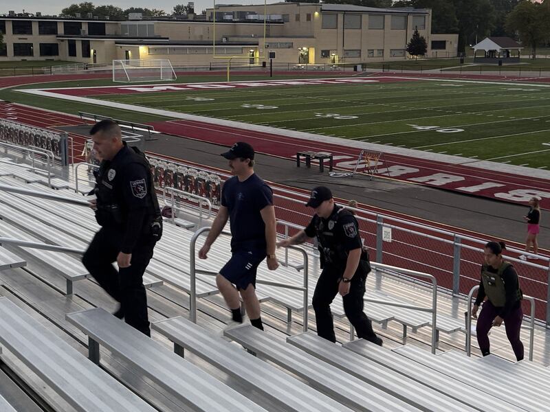 Morris Police officers make their trek up the bleachers on Thursday,  commemorating the efforts of first responders in September 11, 2001. Photo taken on September 11, 2025.