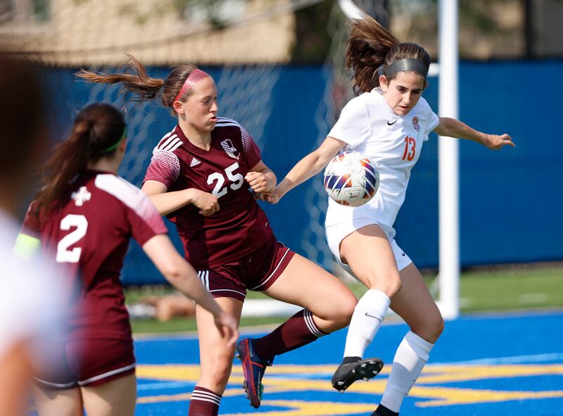 Crystal Lake Central's Jordin Gaunaurd (13) goes up against St. Ignatius' Maggie Helms (25) during the 2A girl's varsity supersectional soccer match between Crystal Lake South and St. Ignatius high schools on Tuesday, June 3, 2025 in Chicago.