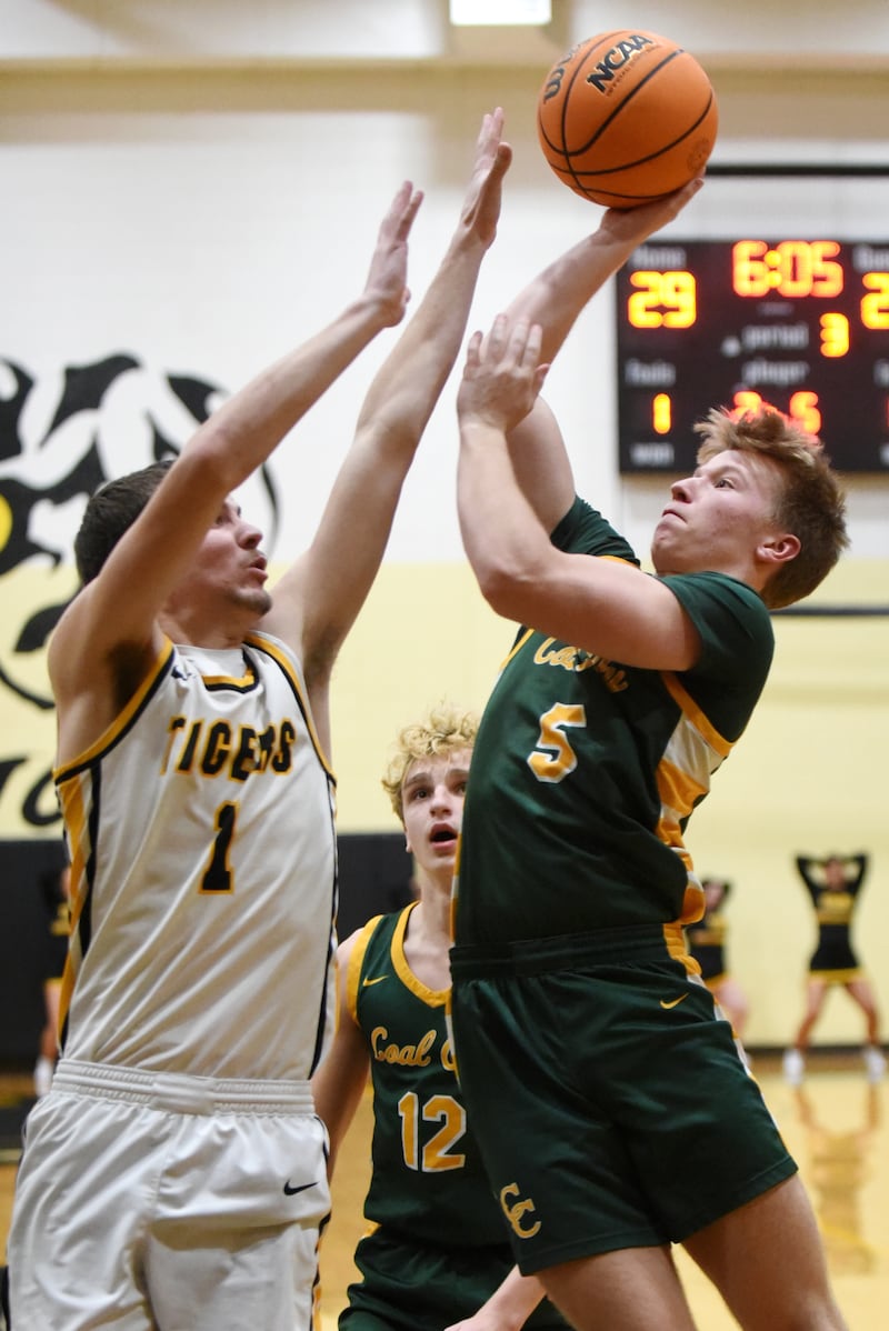 Coal City's Carter Gill, right, takes a shot as Herscher's Tanner Jones defends during a game at Herscher Tuesday, Jan. 27, 2026.