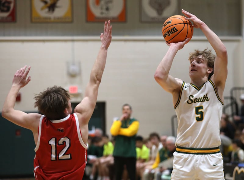 Crystal Lake South's Carson Trivellini shoots the ball over Huntley's Tyler Dudzinski during a Fox Valley Conference boys basketball game on Friday, Jan. 30, 2026, at Crystal Lake South High School.