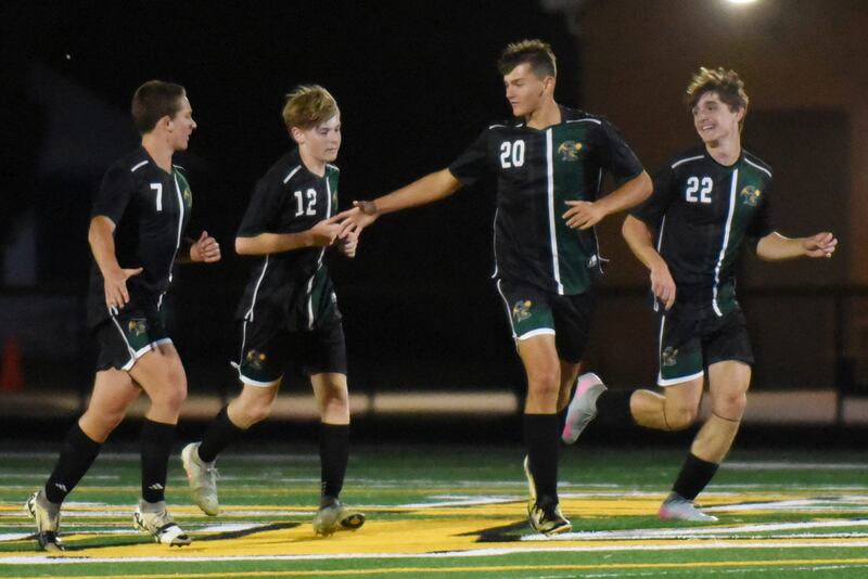 Coal City boys soccer players, from left, Aidan Kenney, Carter Hollis, Martin Ramirez and Parker Jacovec celebrate after a Coalers goal during their home game against Herscher Thursday, Oct. 2, 2025.