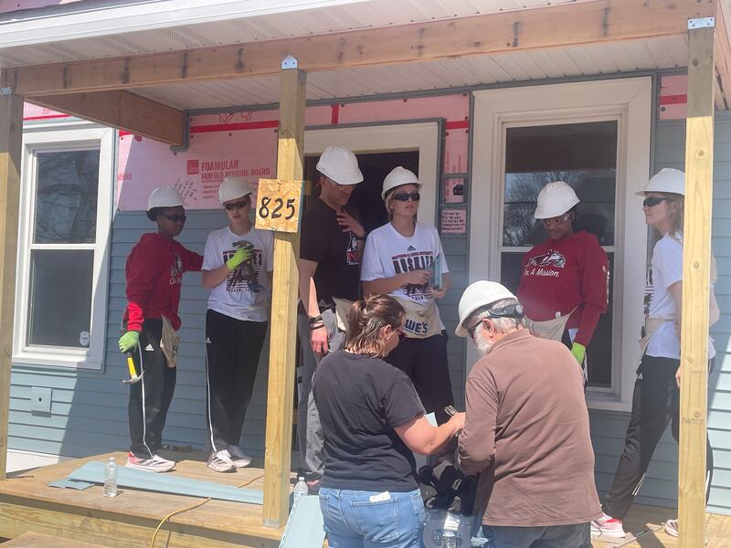 Members of the NIU women's basketball team are seen volunteering during an April 12, 2025, Habitat for Humanity of DeKalb build at the site of the historic Hired Man's House.