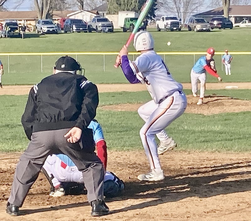 Hall pitcher Luke Bryant fires a pitch against the Trojans in Monday's Three Rivers East game in Mendota. Bryant pitched a five-hit shutout in a 15-0 Hall win.