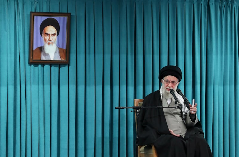 FILE - In this photo released by the official website of the office of the Iranian supreme leader, Supreme Leader Ayatollah Ali Khamenei speaks under a portrait of the late revolutionary founder Ayatollah Khomeini, in a ceremony meeting a group of officials, in Tehran, Iran, March 8, 2025. (Office of the Iranian Supreme Leader via AP, File)
