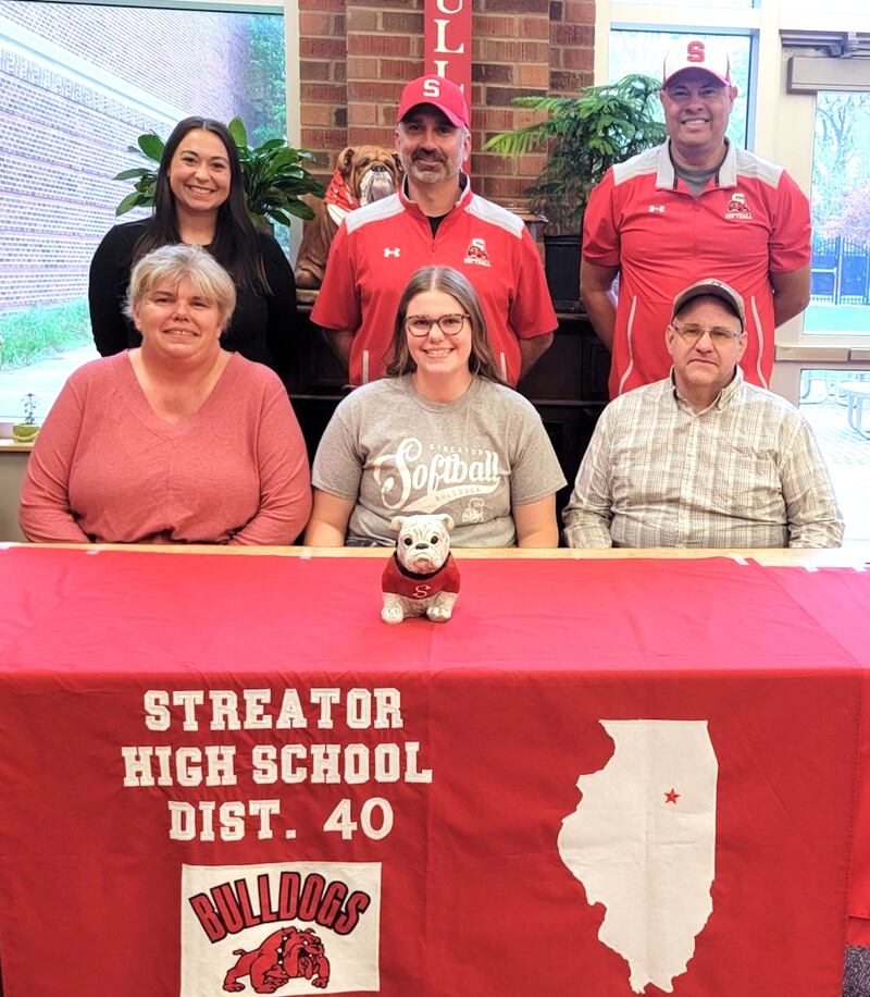 Streator graduate Joyce Walkling has signed on to continue her education at Illinois Valley Community College in Oglesby and her softball career at the NJCAA Division II level with the Eagles. She is pictured here bookended by her parents, Tammy and Steven Walkling, while standing behind are SHS softball coaches (left to right) Lexi Ramon, Louis Ondrey and Michael Zavada.