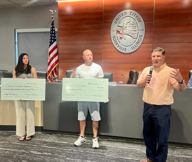Leslie Smogor (from left), president of the Yorkville Educational Foundation, resident Kris Boszko, and Director of Parks and Recreation Tim Evans discuss the recent FORE! Yorkville Golf Outing event fundraiser for the Yorkville Educational Foundation and the Yorkville Parks and Recreation Department at City Hall on Aug. 12, 2025.