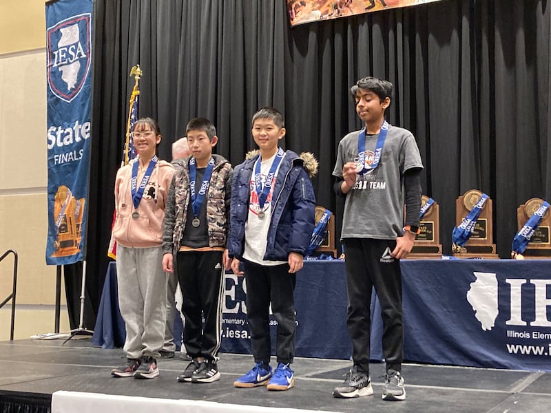 In the seventh grade section of the annual State Chess Finals, which was organized by the Illinois Elementary School Association, the 2026 State Champion is Shrini Senthilkumar (first, right) and Morrison Junior High School student  Cindy Pelka (first, left) and others pose for a picture at the Peoria Civic Center in Peoria.