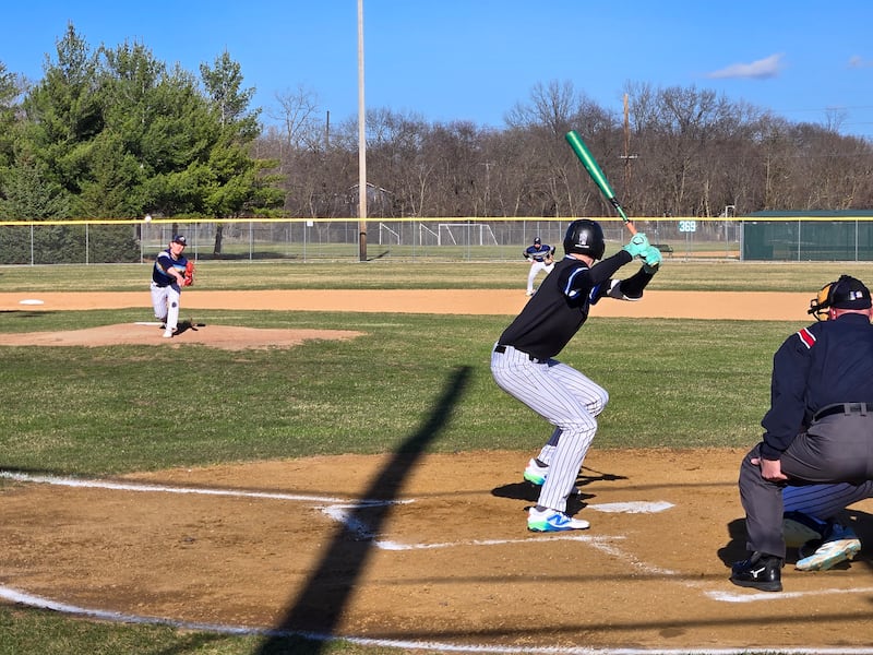 Marquette's Grant Dose delivers a pitch to Newark's Payton Wills in the first inning of Monday's game at Masinelli Field in Ottawa.