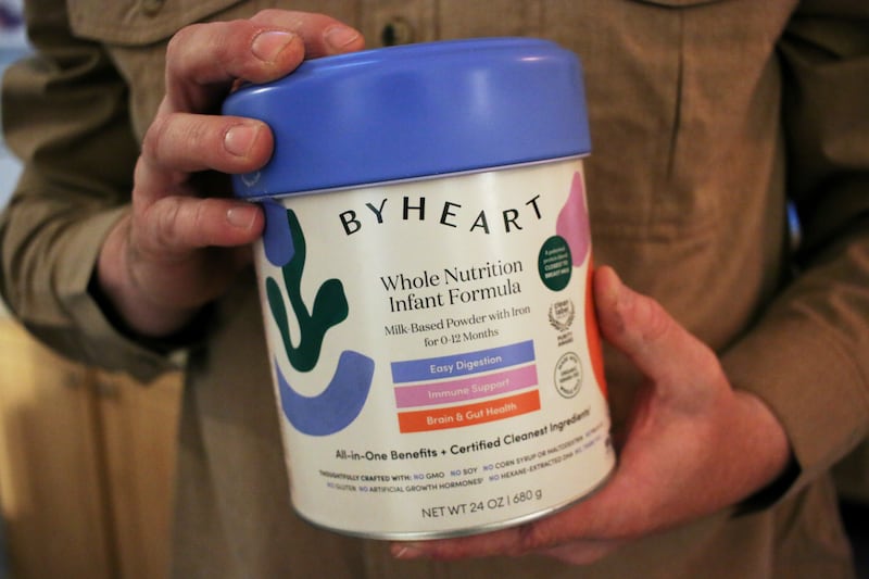 FILE - Stephen Dexter holds a container of ByHeart baby formula, which was recently recalled by ByHeart, in Flagstaff, Ariz., on Wednesday, Nov. 12, 2025. (AP Photo/Cheyanne Mumphrey, File)