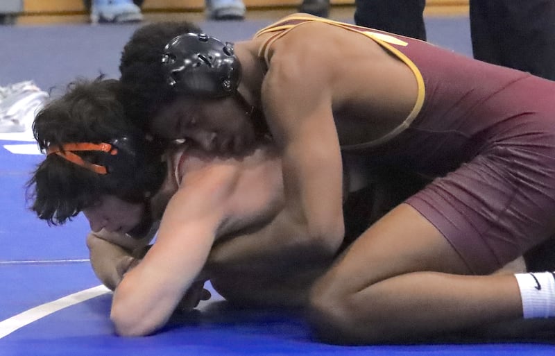 Lockport's Justin Wardlow grapples with Lincoln-Way West's Luke Siwinski during the 138-pound Class 3A Quincy Sectional final match.