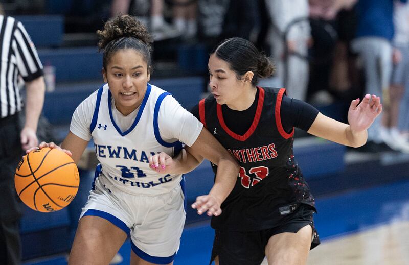Newman’s Gisselle Martin drives against Erie-Prophetstown’s Ava Grawe Thursday, Jan. 29, 2026.