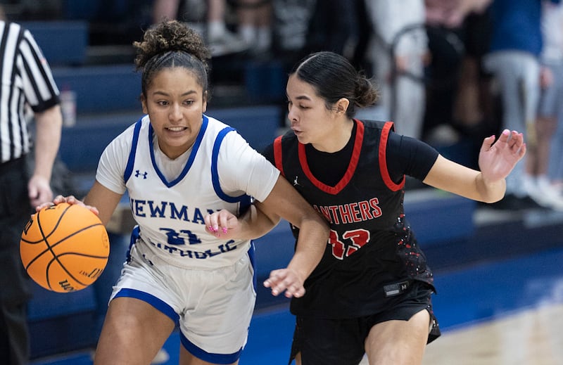 Newman’s Gisselle Martin drives against Erie-Prophetstown’s Ava Grawe Thursday, Jan. 29, 2026.