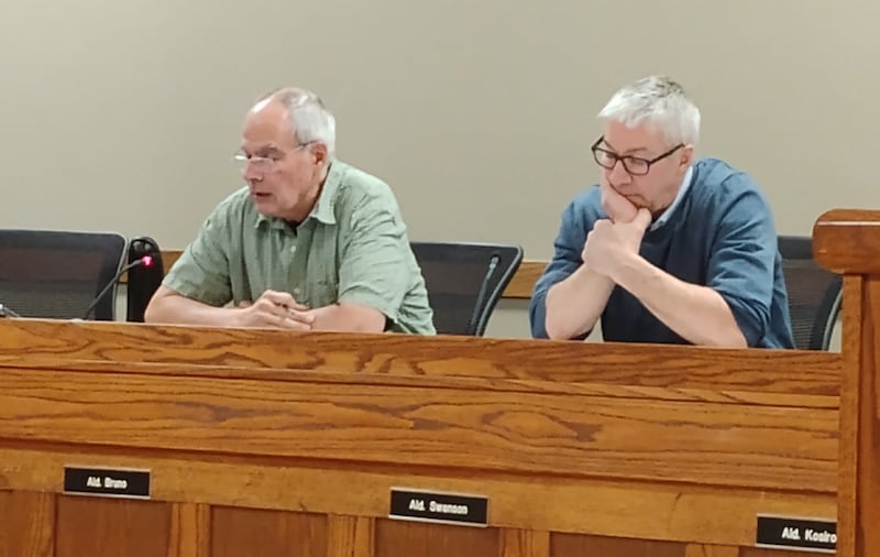 Geneva 1st Ward Alderperson Michael Bruno (left) makes the case for changing the city's ordinance not to allow liquor license holders to serve in elected office. Fifth Ward Alderperson Robert Swanson disagreed, saying, '(T)his is a solution seeking a problem.'
