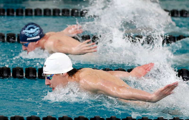 Cary-Grove’s Kasparas Venslauskas (foreground) and D300 Co-op’s Luke Johnson compete in the 200 IM during the Fox Valley Conference Invitational swim meet on Saturday, Feb. 15, 2025, at Woodstock North High School.