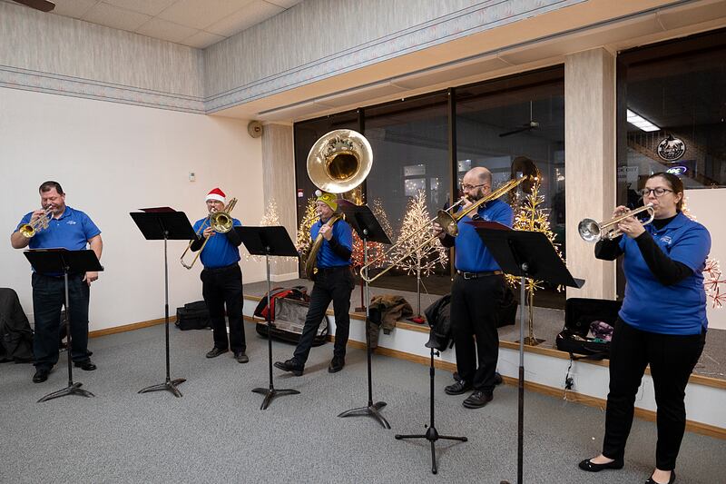 The Sterling Municipal Band belts out a Christmas tune Friday, Dec. 6, 2024, during Sterling’s Sights and Sounds Christmas event.