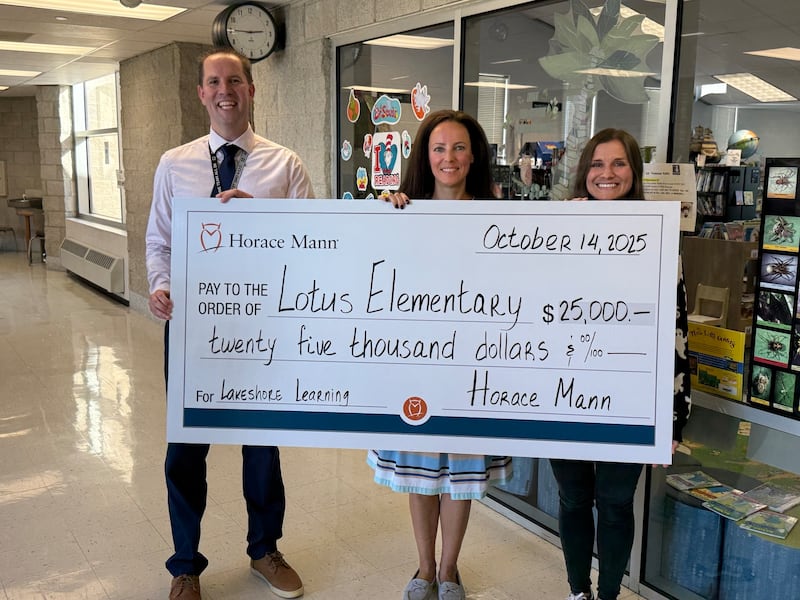 From left to right: Lotus Elementary School principal Matt Peters, Horace Mann agent Alina Knish and Lotus Elementary School teacher Kelly Roland with the $25,000 grand prize sweepstakes check.