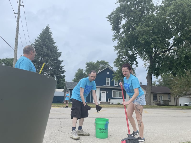 “I like to help out the community," said Mark Wheelock of La Salle, pictured at left, "It’s a good cause.” Wheelock was accompanied Sunday, June 7, 2026, by Noah (center) and Hope (right) Wheelock as they cleaned curbs in preparation for painting on First Street in La Salle. The curb improvements are part of the "Hope Week" endeavor by Ax Church in La Salle.
