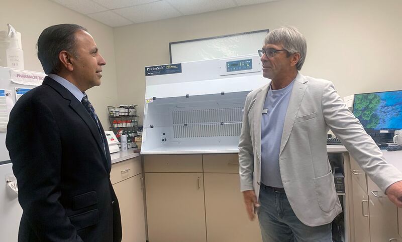 U.S. Rep. Raja Krishnamoorthi, left, speaks Friday, July 11, 2025, with Petersburg Pharmacy owner Dave Bagot during a tour of the facility.