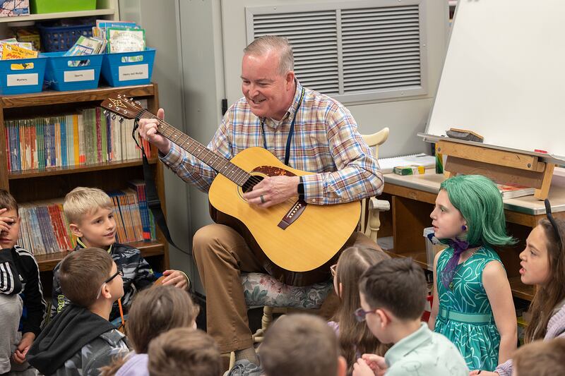 Brian Lobdell, a second grade teacher at Franklin Elementary School in Sterling, starts the day with a song and meeting with his students Thursday, March 27, 2025. The meeting lets the students know what they’ll be working on for the day.