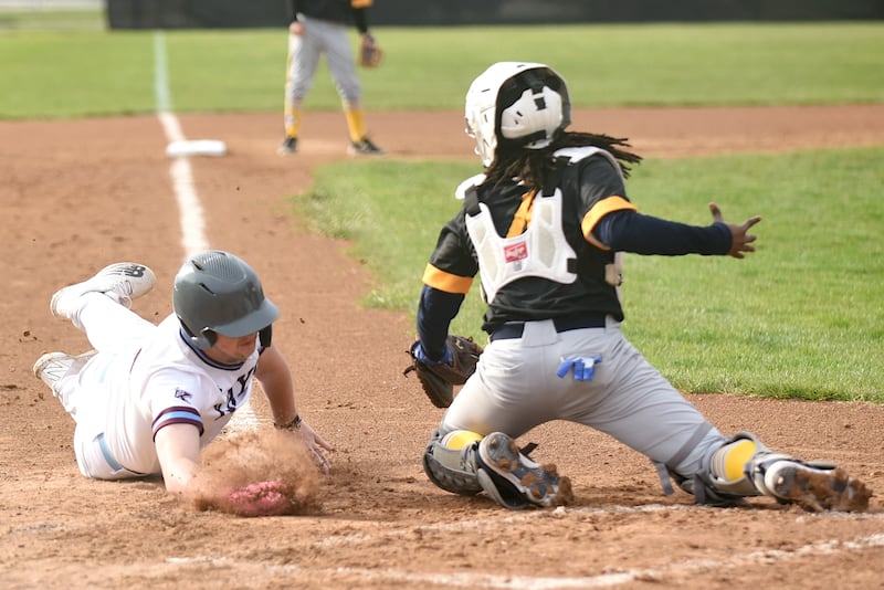 Kankakee's Zach Wright, left, attempts to avoid a tag from Thornwood catcher Kordae Montgomery during a game at Kankakee Thursday, April 17, 2025.
