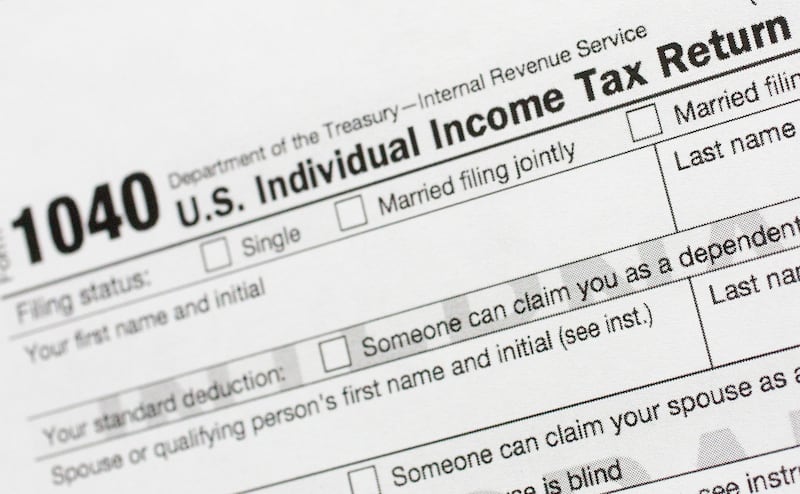 FILE - A portion of the 1040 U.S. Individual Income Tax Return form is shown July 24, 2018, in New York. (AP Photo/Mark Lennihan, File)