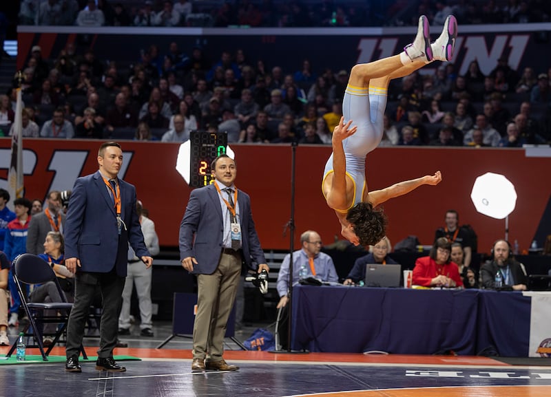 Marquette’s Wesley Janick does a flip after winning the 1A 120-pound state title this past season at the IHSA wrestling finals in Champaign.