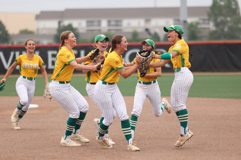 Providence Catholic players celebrate as they secured a 5-2 win over St. Laurence in the IHSA Class 3A state semifinal on Friday, June 13, 2025.
