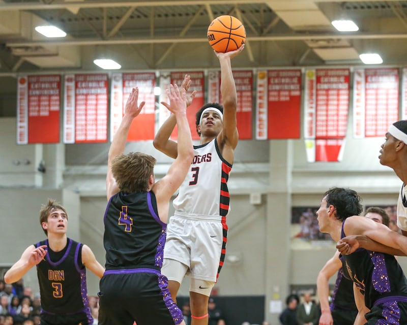 Bolingbrook's Davion Thompson (3) puts up a shot in front of the rim during their Class 4A Bolingbrook Sectional semifinal basketball game between Downers Grove North at Bolingbook. March 4, 2025 in Lisle.