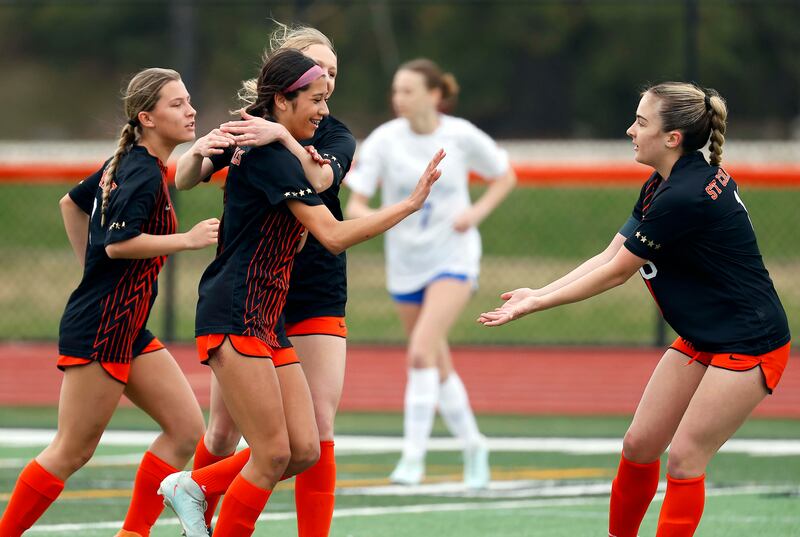 St. Charles East's Mya Leon (7) celebrates her first goal against St. Charles North during the championship game of the Rose Augsburg Drach Invitational Saturday, March 29, 2025 in St. Charles Ill.