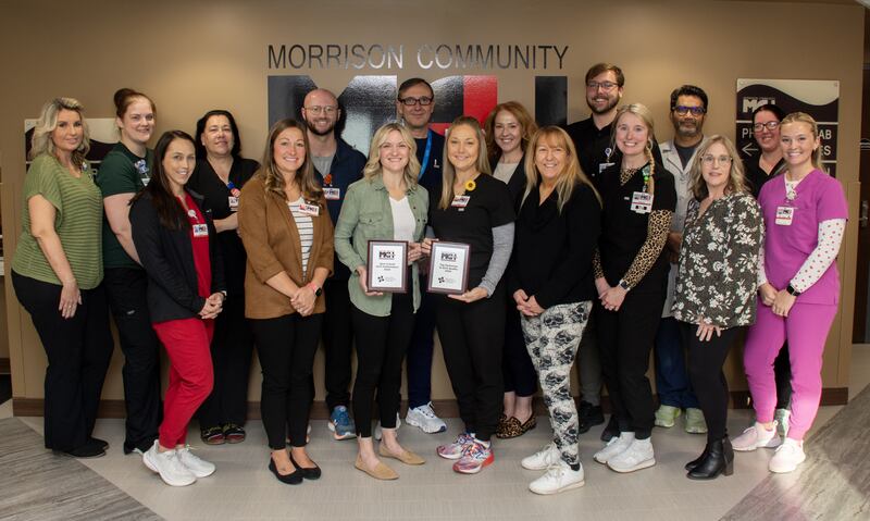 Providers and nurses from Morrison Community Hospital pose with their two awards Best Overall for both Quality and Annual Wellness Visits and Best in Quality award (co-winner) based on Illinois Rural Community Care Organization evaluations on Morrison's 2024 work.