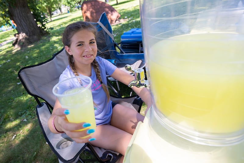 Vida Rubio, 11, was selling lemonade, SunnyD and chips to help fund her trip Monday, June 23, 2025, at her stand in Dixon.
