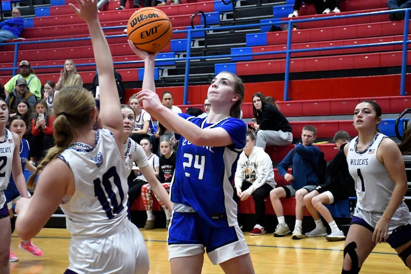 Peotone's Payton Pape sets to shoot while Wilmington's Taylor Stefancic contests during Peotone's 35-32 victory over Wilmington in the Iroquois West Holiday Tournament on Wednesday, December 17, 2025.