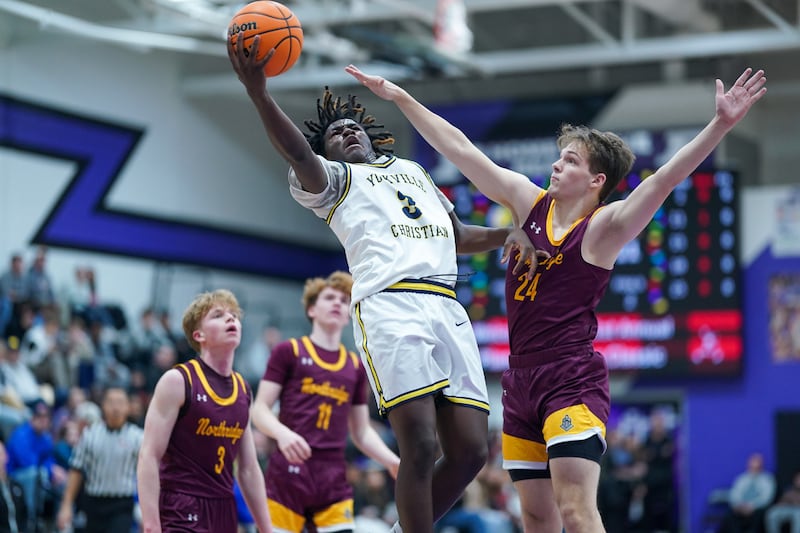 Yorkville Christian's Jayden Riley (3) drives to the hoop against Northridge Prep's Mark Scherer (24) during a semi-final basketball game in the 61st annual Plano Christmas Classic at Plano High School on Friday, December 27, 2024.