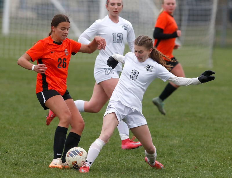 Crystal Lake Central's Skyler Ferrero battles with Kaneland's Zoe Gannon for control of the ball during a nonconference soccer game on Thursday, April 10, 2025, at Crystal Lake Central High School.